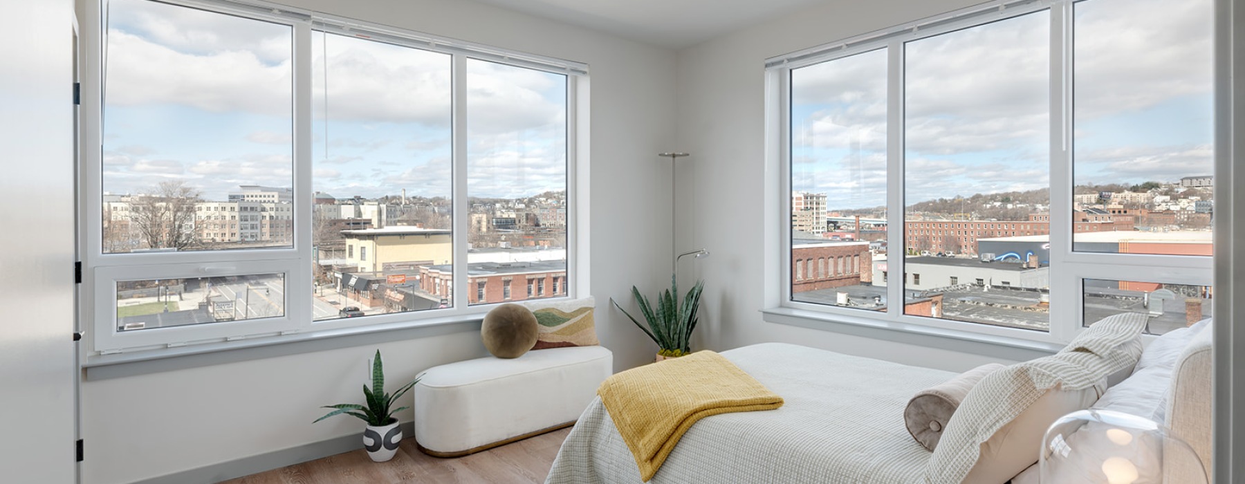bedroom with bed and large windows